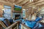 LIVING RM w/WOOD FIREPLACE & LARGE TV